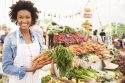 Female Stall Holder At Farmers Fresh Food Market